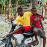 Two Boys Riding a Motorcycle