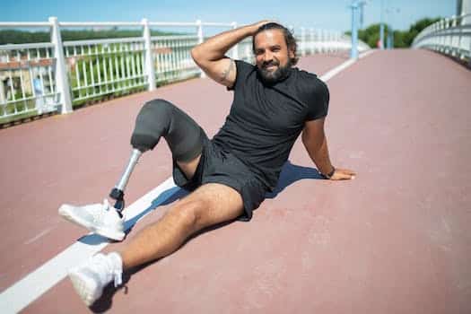 A Man in Black Sports Wear with Amputee Leg