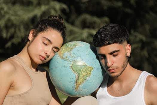 A Couple Head's Leaning on a Globe