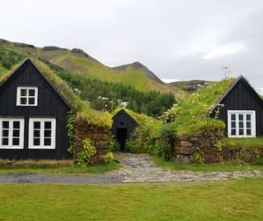 House on Green Landscape Against Sky