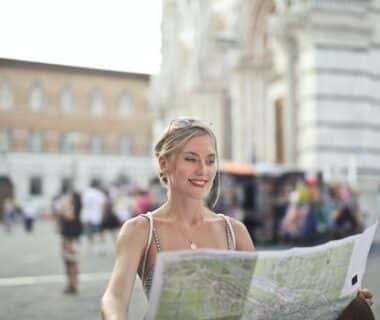 Woman Holding A Map Looking For Next Destination